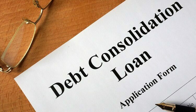 Debt consolidation loan form on a wooden table.